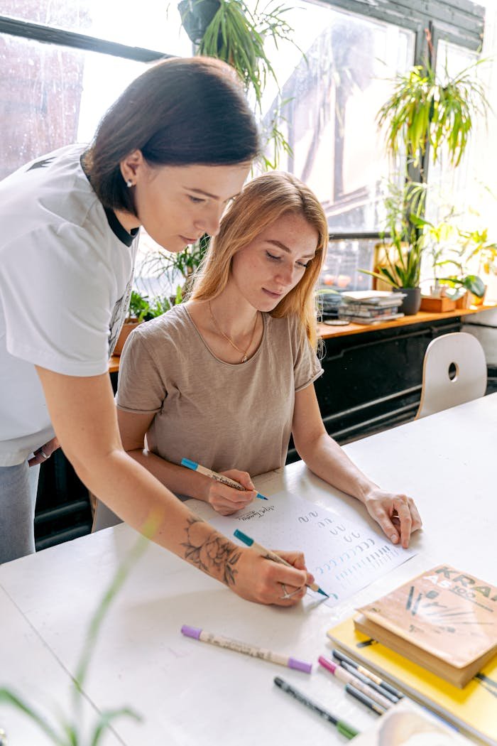 A Woman Teaching her Student at an Art School